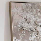 Framed artwork of a floral design on a neutral background