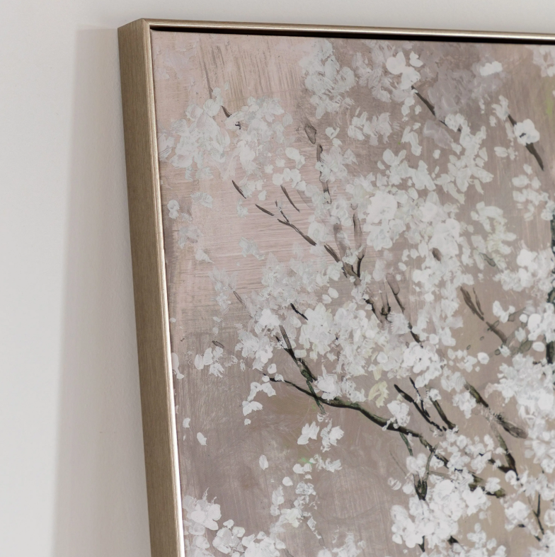 Framed artwork of a floral design on a neutral background