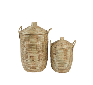 Two woven natural-fiber storage baskets with lids and side handles, shown on a plain white background.