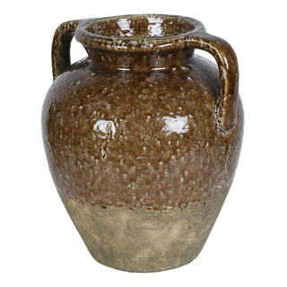 A rustic ceramic vase with a rounded body, two side handles, and a wide flared rim, featuring a mottled brown and beige glaze on a white background.