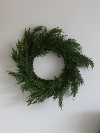 Close detail of the real touch cedar pine foliage on the wreath