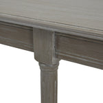 Close-up of a wooden table with a grayish-brown finish on a white background