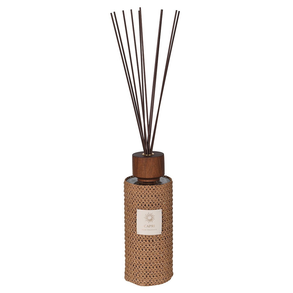 Reed diffuser with woven design and wooden top on a white background