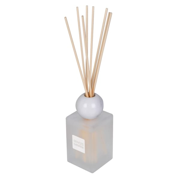 A reed diffuser with a frosted glass cube base, a white spherical top, and natural wood reeds, shown on a plain white background.