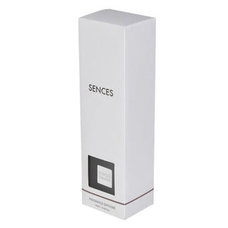 A tall, slender white rectangular box for a fragrance diffuser, with the brand name 'SENCES' printed in black near the upper middle. A small black label window is near the bottom, along with the text 'FRAGRANCE DIFFUSER' and 'LIGHT PINK'.