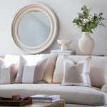 This gorgeous round mirror is complete with distressed silver detailing.