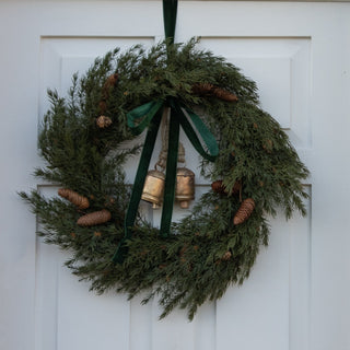 Ashdown 76cm faux cedar wreath with pinecones, styled with ribbon and bells not included