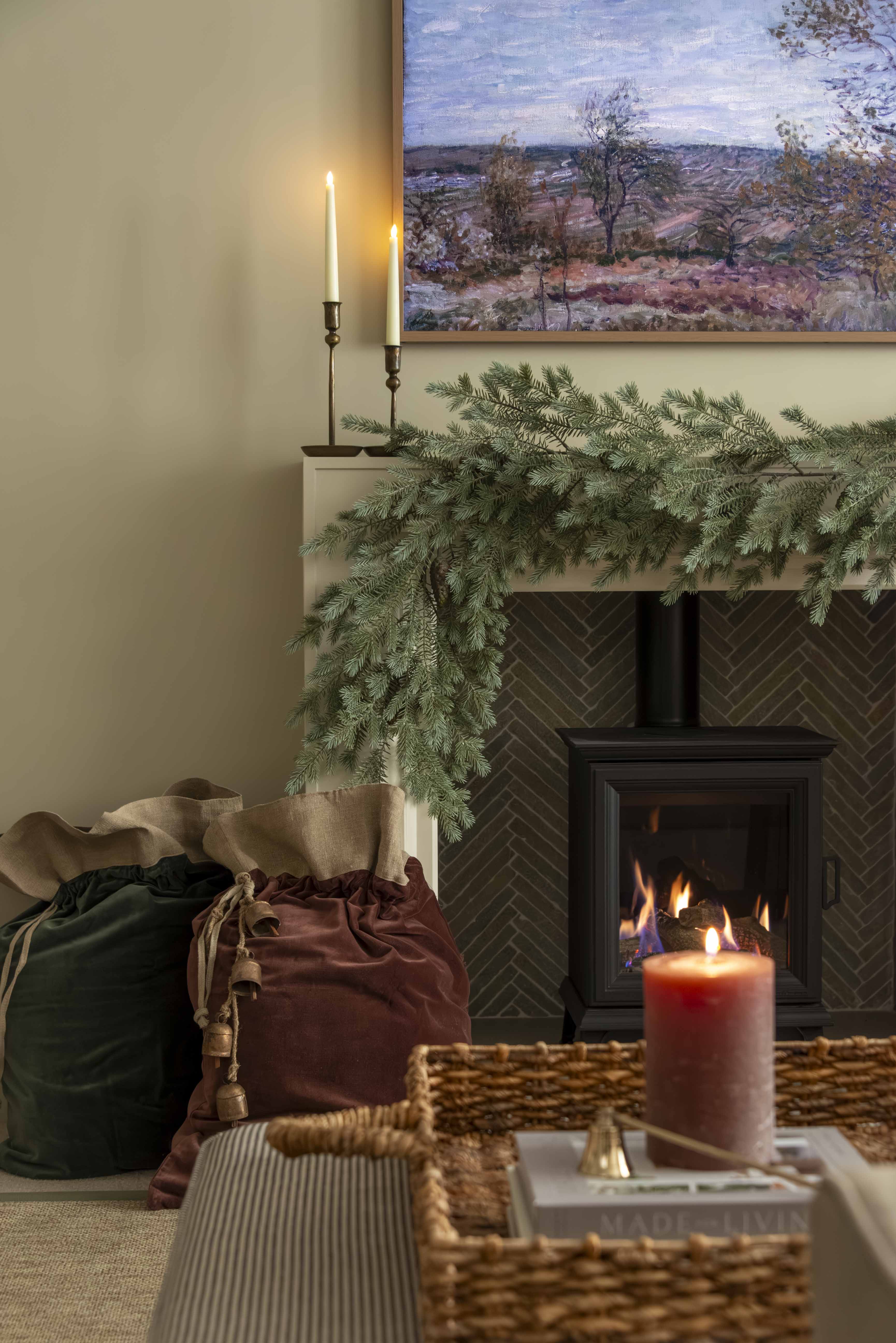 Charles Ted Cotton Velvet Christmas Sack in mocha with linen top and jute tie placed under a Christmas tree by a fireplace