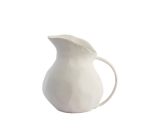 White ceramic pitcher on a white background