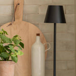 Black iron wireless lamp styled with kitchen accessories