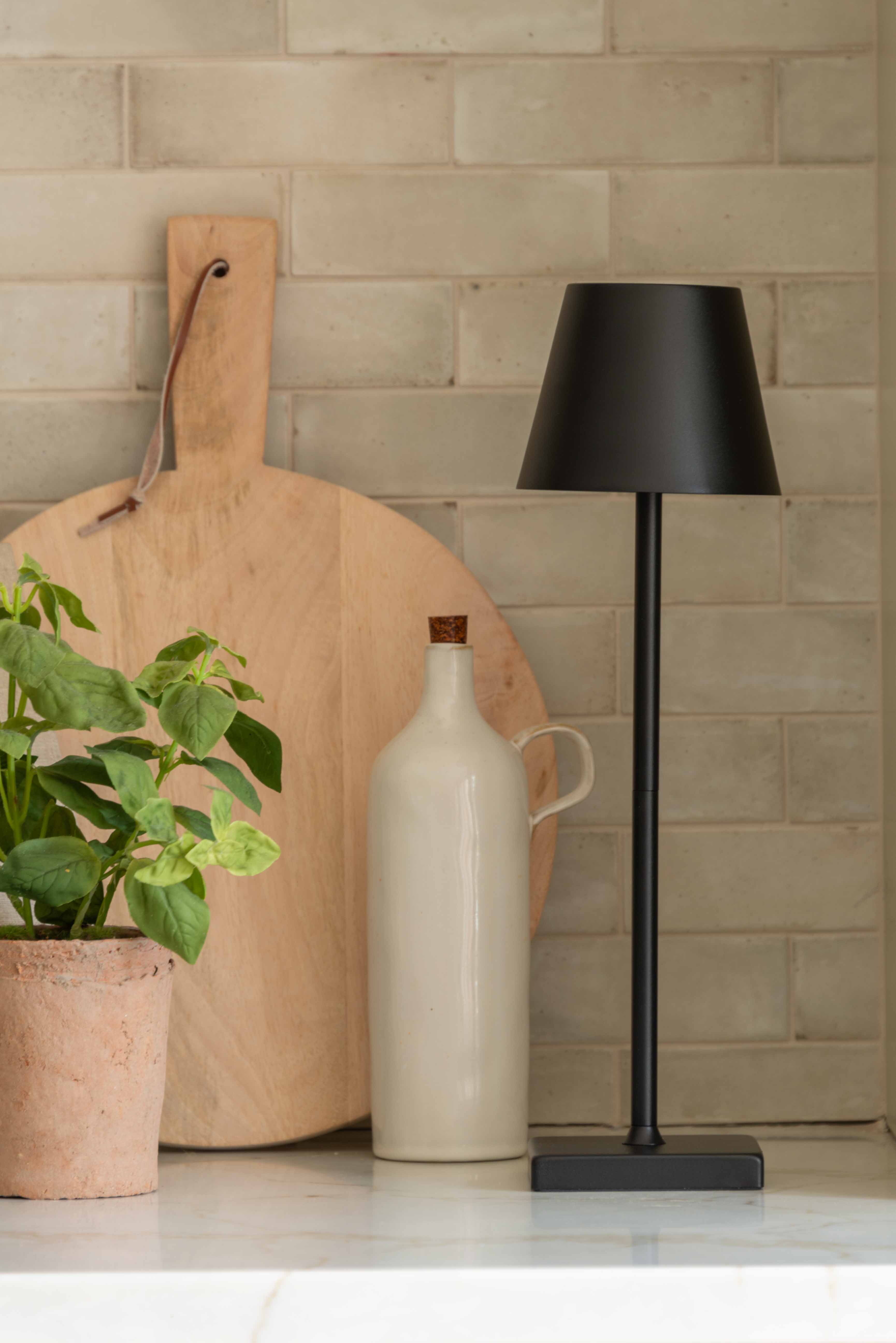 Black iron wireless lamp styled with kitchen accessories