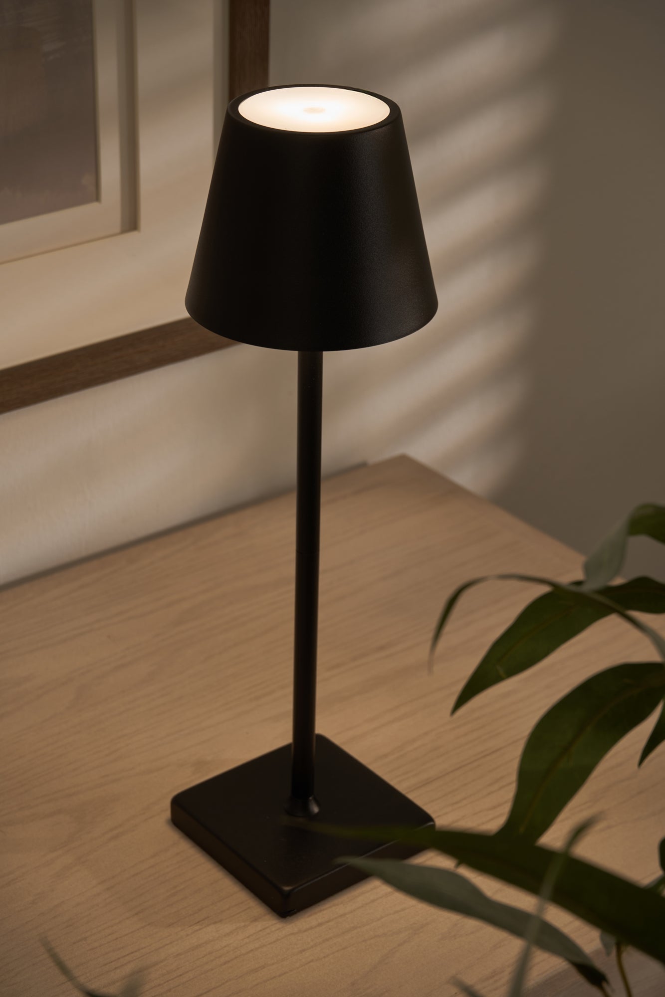 Modern black table lamp styled in a contemporary living space