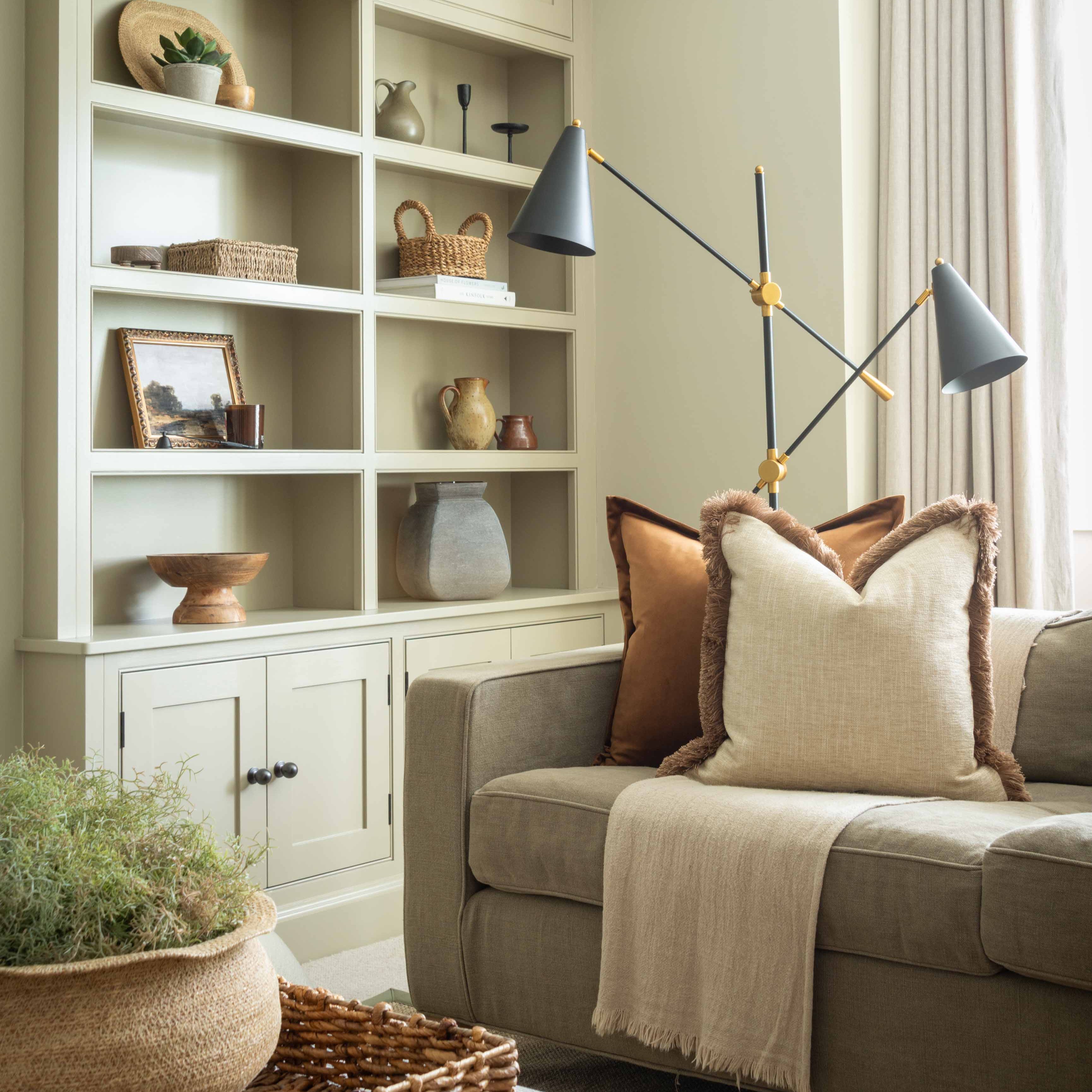 Charles Ted black and brass floor lamp styled in a living room with neutral decor