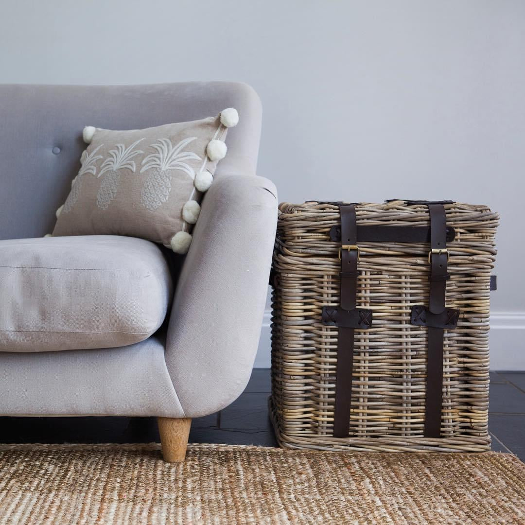 Wicker end table with lid and leather buckles