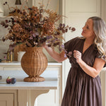 Charles Ted Shola Rattan Vase styled with autumn floral arrangement on kitchen island