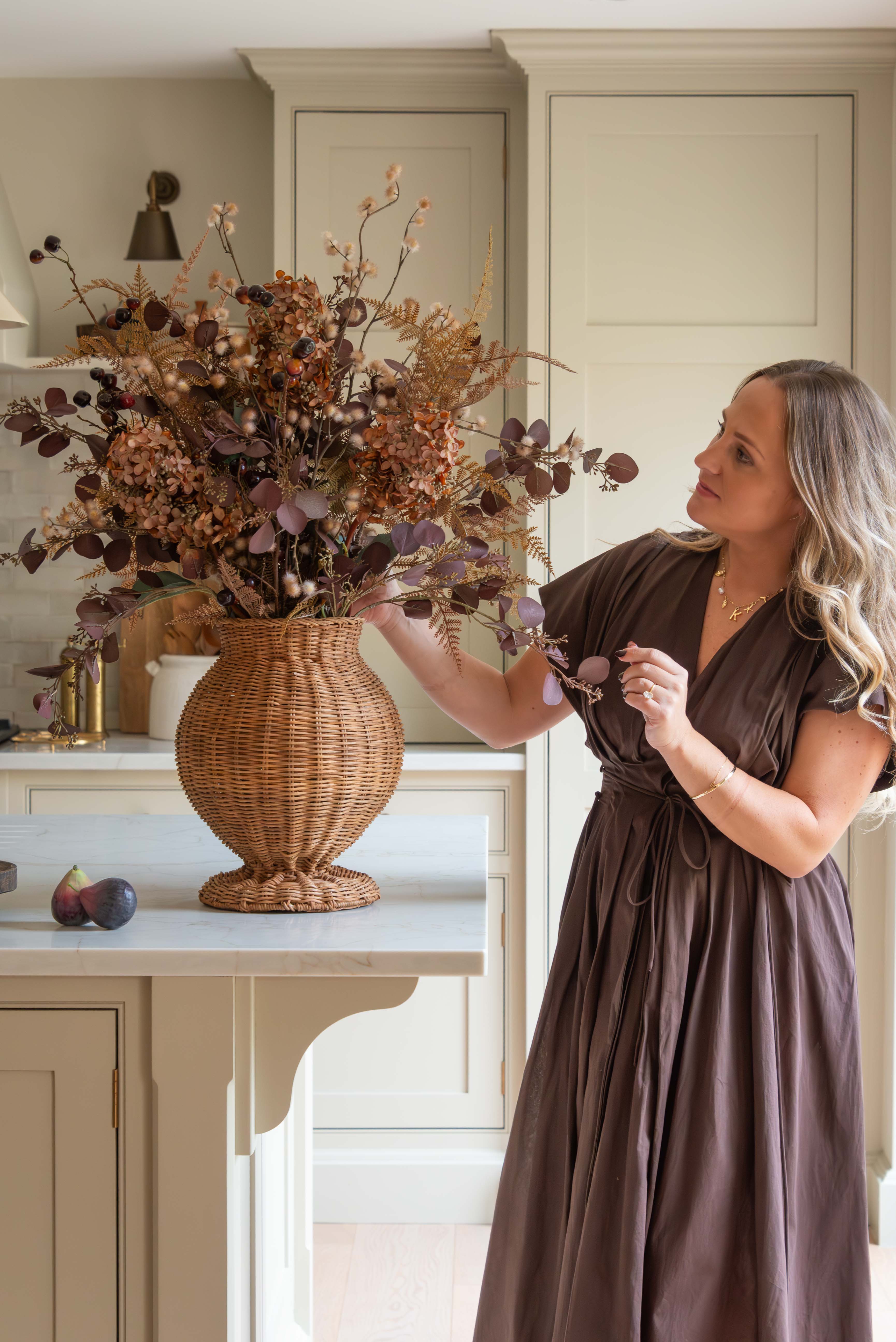 Charles Ted Shola Rattan Vase styled with autumn floral arrangement on kitchen island