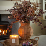 Handwoven Charles Ted Shola Rattan Vase with figs and candle by fireplace