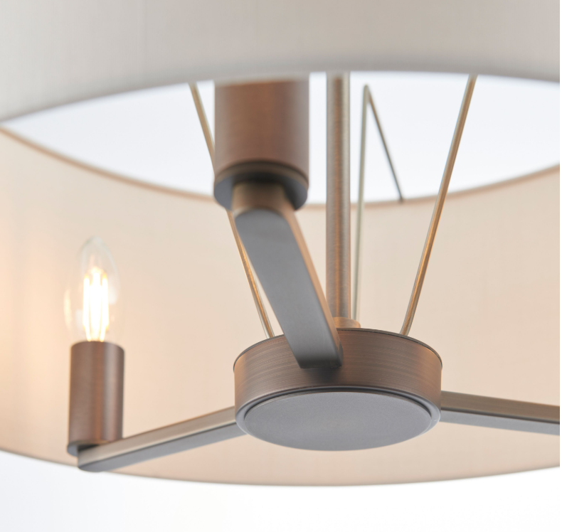 Ceiling light fixture with metallic finish and linen shade