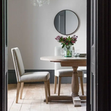 Pair of Cleeve Linen Dining Chairs with dining table in modern room setting