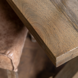 Close up detail of Clevedon Mango Wood Dining Table base showing natural grain