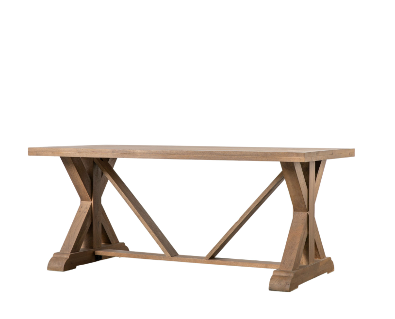 Wooden dining table with X-shaped base on a white background