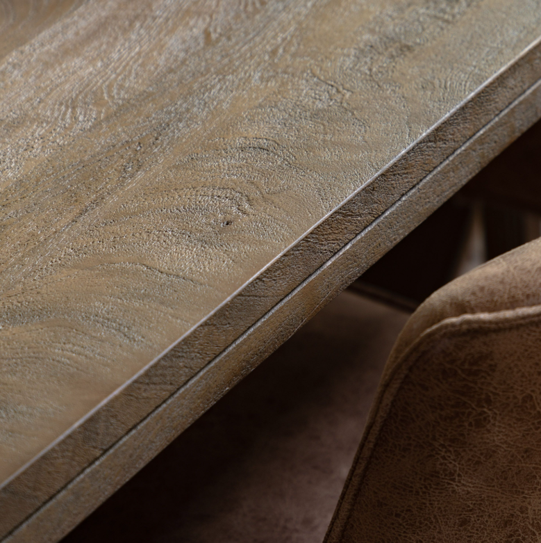 Close up detail of Clevedon Mango Wood Dining Table base showing natural grain