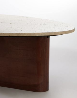 Close-up of Como table travertine top showing natural pitted sand-toned stone texture
