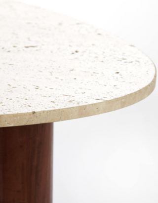Close-up of Como table travertine top showing natural pitted sand-toned stone texture