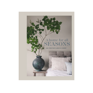 Book cover depicting a branching plant growing in a vase next to a bed