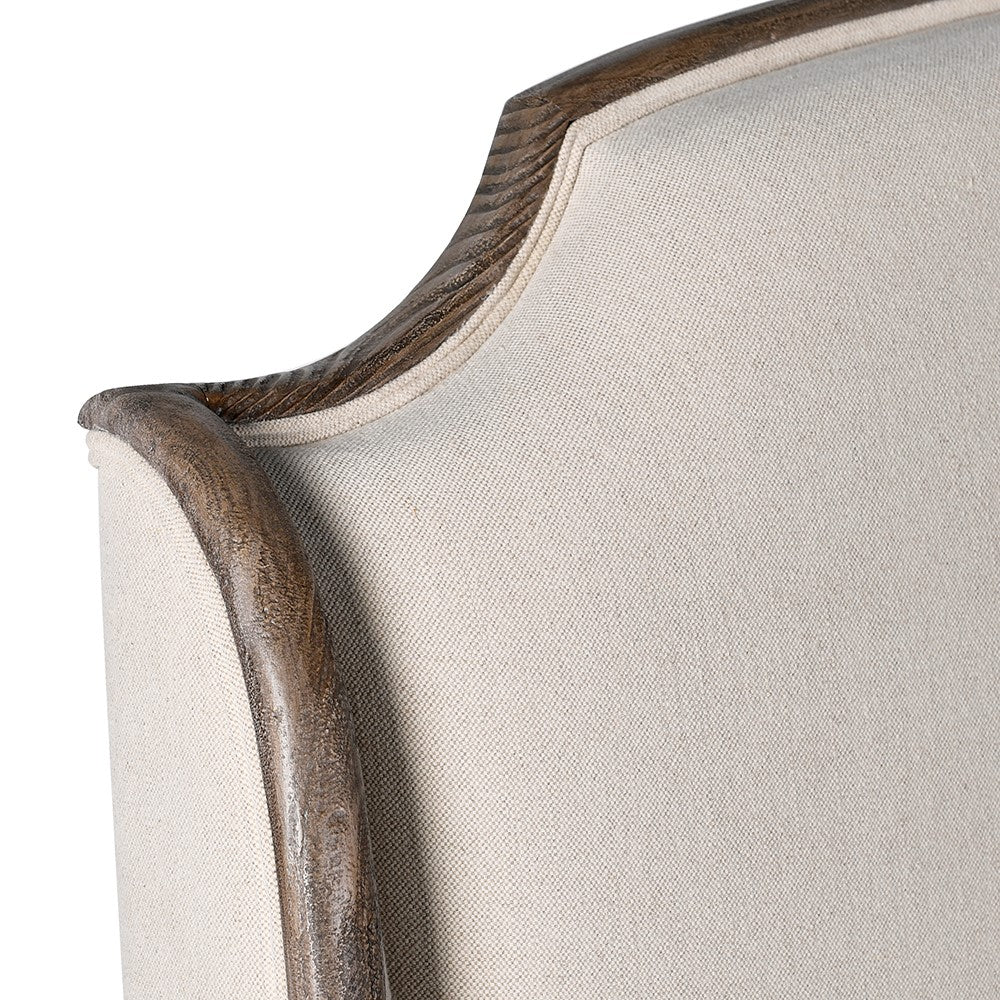 Detailed view of old pine trim and linen upholstery on Cotswolds bed frame