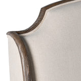 Detailed view of old pine trim and linen upholstery on Cotswolds bed frame