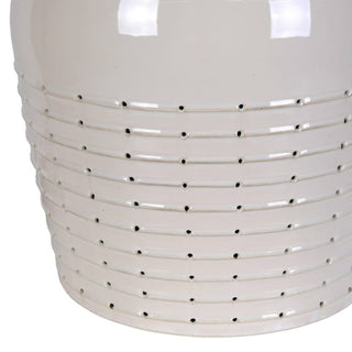 Pierced banding detail on a cream ceramic lamp base