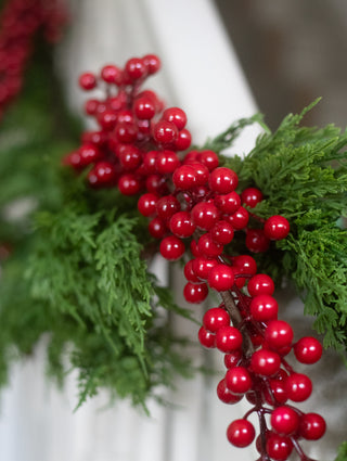 Close detail of the glossy faux red berries on the cascade garland