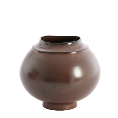 Deep brown glazed ceramic vessel with rounded silhouette and slightly uneven opening