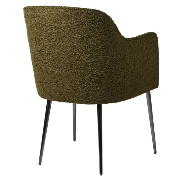 Deanna Olive Green Faux Sheepskin Dining Chair - a luxurious addition to elevate any dining space. Its elegant design, featuring faux sheepskin upholstery and a tasteful olive green colour, exudes exclusivity and sophistication.