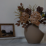 Brown Amaranthus in a round terracotta vase