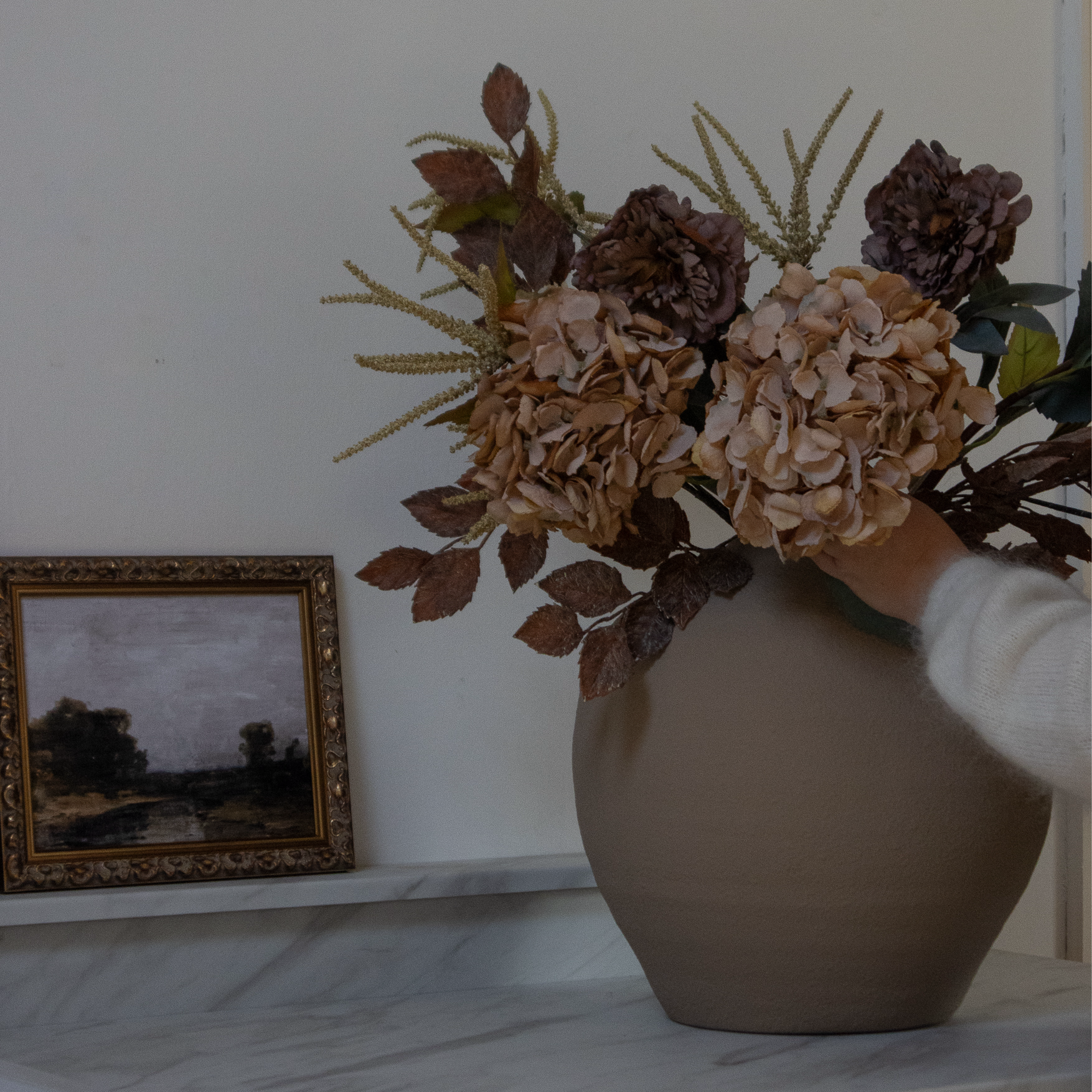 Brown Amaranthus in a round terracotta vase
