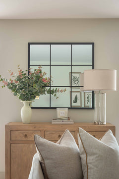 Add a touch of modern elegance to your home with this contemporary glass table lamp, featuring a clear cylindrical base and a soft neutral fabric drum shade. Perfect for bedside tables, console tables, or living room sideboards, this minimalist lamp blends effortlessly with both modern and transitional decor styles. The lamp's sleek silhouette and neutral tones make it ideal for creating a calming, stylish ambiance in any interior space. Whether you're looking for a bedside lighting solution or a chic decor