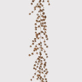 Dried floral branch on a light gray background