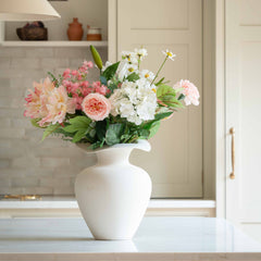 Bring timeless charm and natural beauty into any space with our Elegant Pastel Flower Bouquet, a handcrafted arrangement featuring soft blush pink roses, delicate white lilies, hydrangeas, daisies, and lush greenery. This luxury floral bouquet is designed to add a fresh, romantic touch to your home, wedding, or special occasion.

Perfectly wrapped in eco-friendly kraft paper, this premium artificial flower bouquet offers lasting beauty without the need for watering or maintenance. Whether displayed in a vas