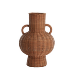 Wicker vase with two handles on a white background