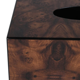 Close-up of a dark brown burl wood tissue box cover with a glossy finish and a black oval cutout on top, showing detailed wood grain patterns.