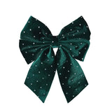 Emerald green velvet decorative bow with rhinestone accents for holiday or gift décor