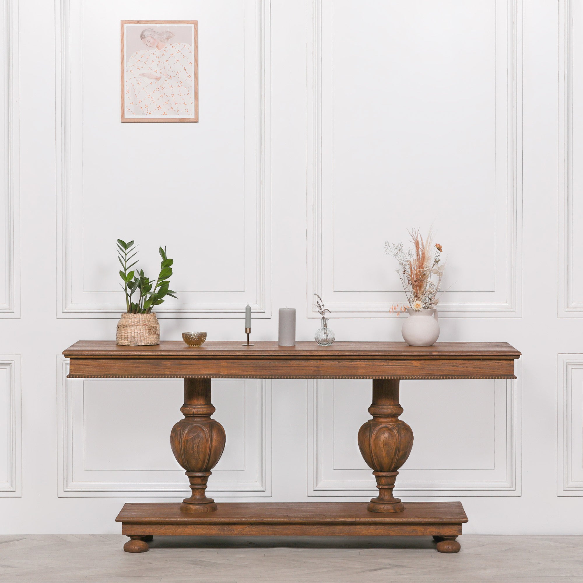 Ernest console table crafted from white cedar stained in a rich brown finish with carved column legs and beaded edge detail
