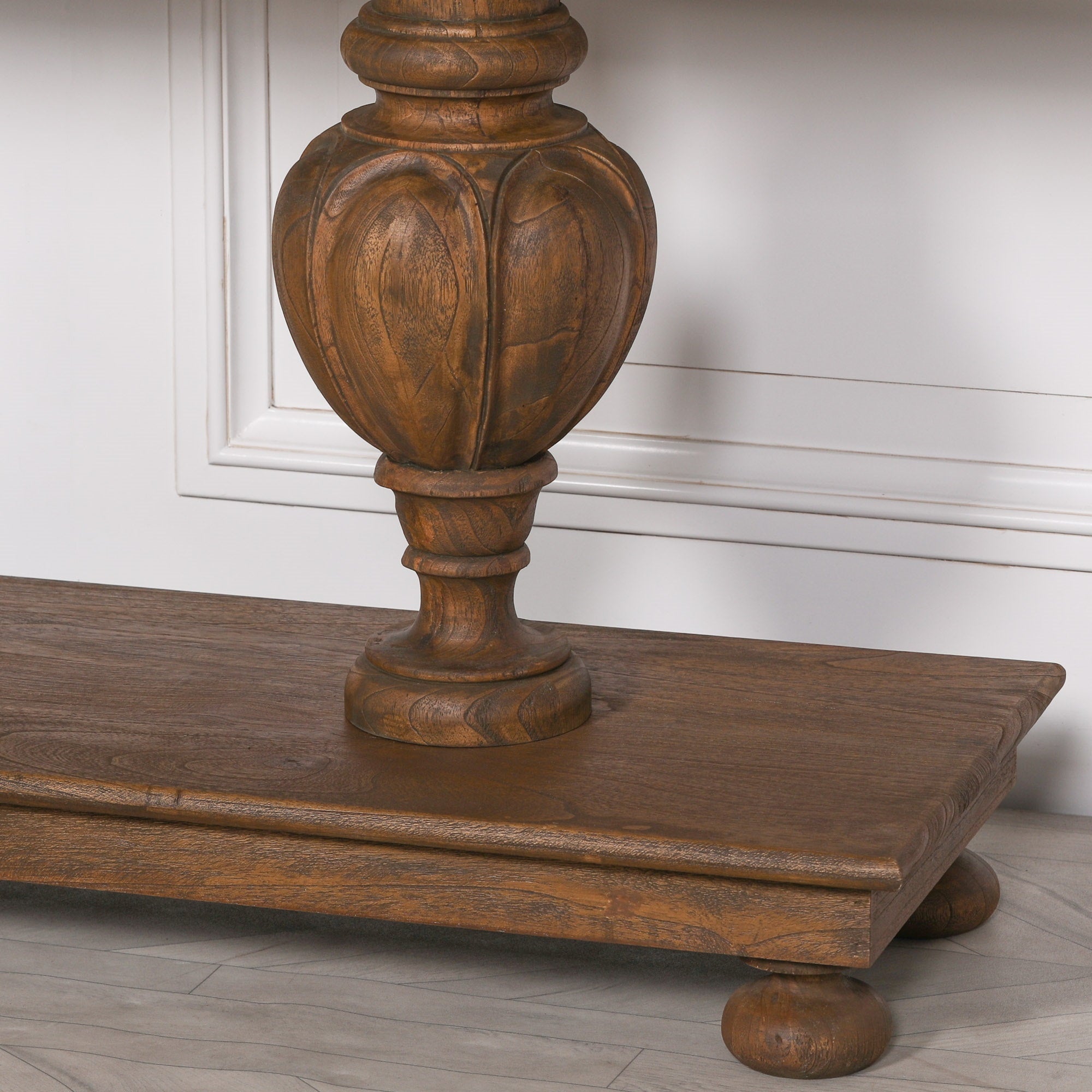 Ernest console table crafted from white cedar stained in a rich brown finish with carved column legs and beaded edge detail