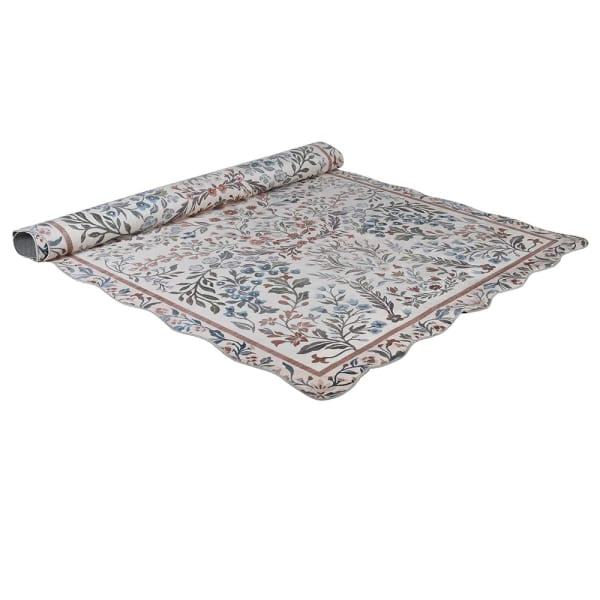 Evangeline vintage inspired scallop edge rug partially rolled showing floral border and scalloped edge