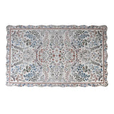 Evangeline vintage inspired scallop edge rug partially rolled showing floral border and scalloped edge
