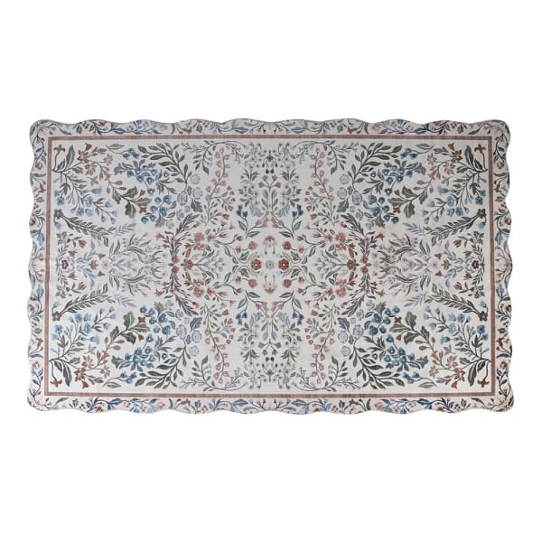 Evangeline vintage inspired scallop edge rug partially rolled showing floral border and scalloped edge