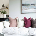 A stunning plum cotton cushion with a beautiful check Detail in cream.