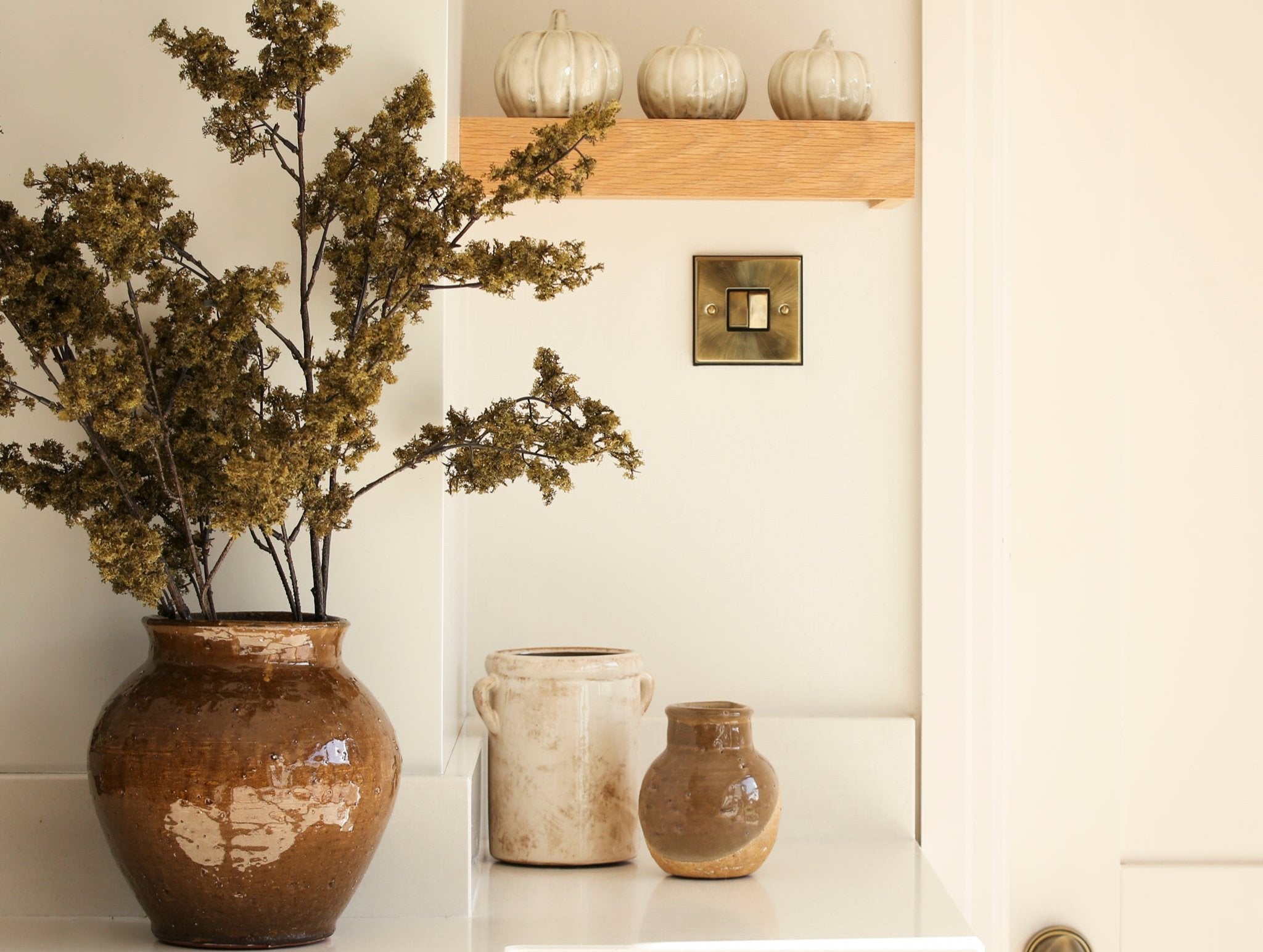 A gorgeous textured ceramic vase finished in a brown glaze.